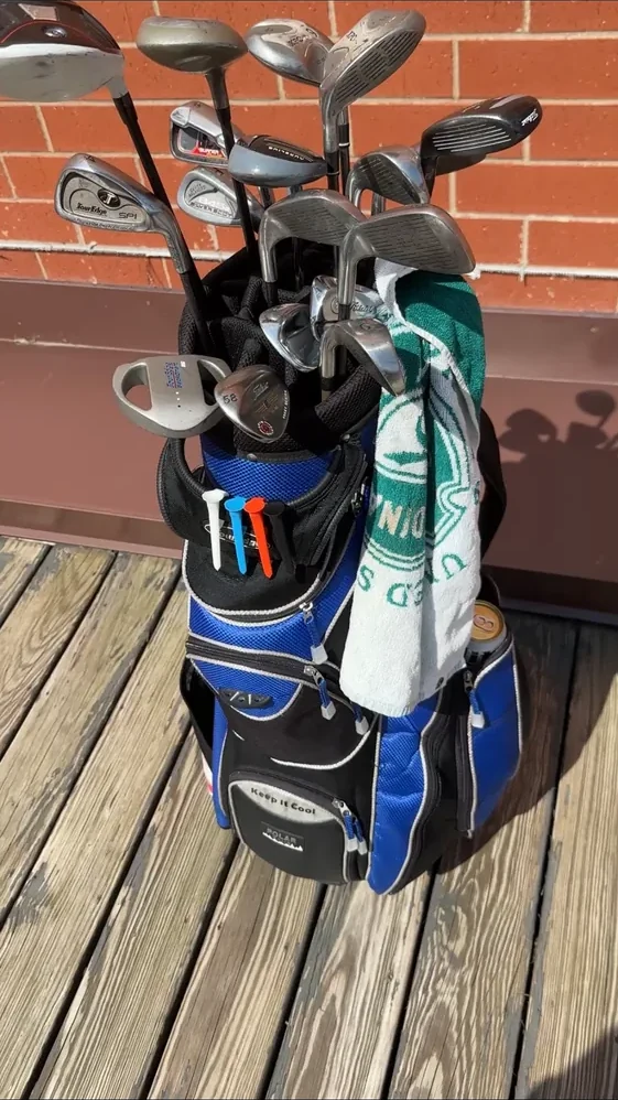 Actual Shotgun Start Tee attached to a golf bag