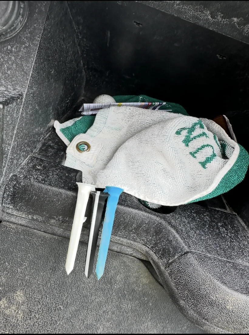 Shotgun Start Tees and golf glove on a golf cart